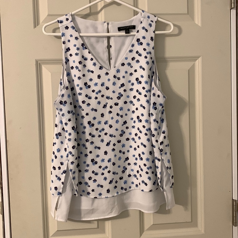 White and blue floral sleeveless Banana Republic blouse.